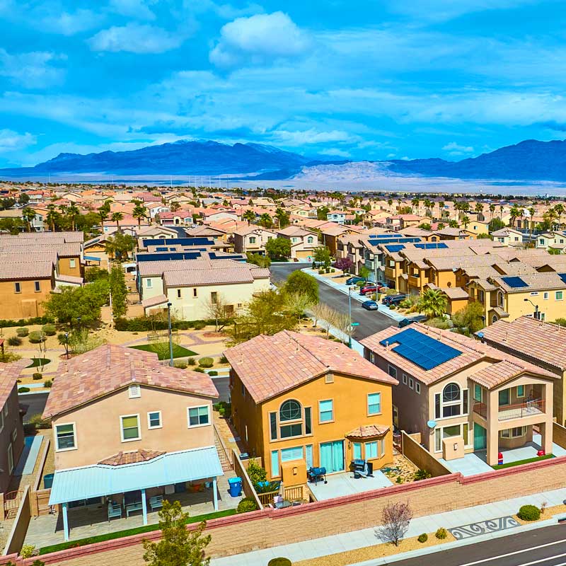 Aerial view of Nevada suburban neighborhood with mountains and lake – how to get the best Nevada hard money rates