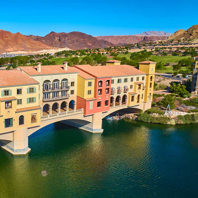 Colorful bridge village over water at Lake Las Vegas – common Nevada closing delays and prevention strategies