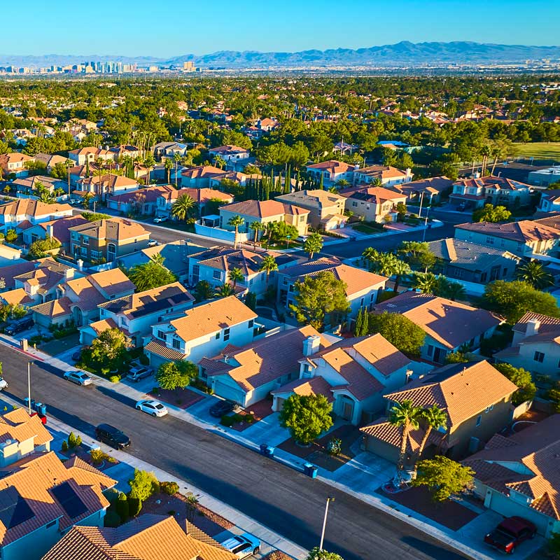 Las Vegas suburban neighborhood with skyline and mountains – fix‑and‑flip market for Nevada hard money loans