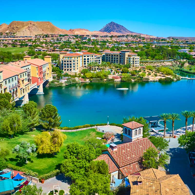Panoramic view of Nevada suburban city with mountains and blue sky – Nevada Real Estate Market 2025 forecast