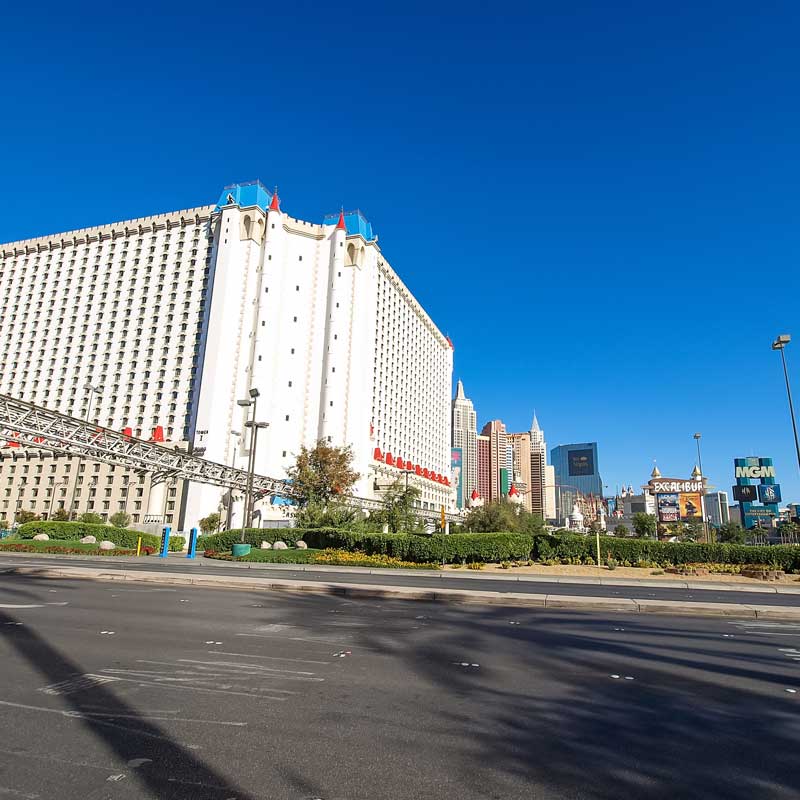White high‑rise hotel on the Las Vegas Strip with pedestrian bridge and wide boulevard – required documents for Nevada fix‑and‑flip and commercial loans