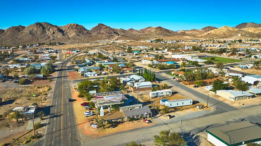 nevada-small-town-homes-and-desert-road-with-mountain-landscape small town homes and desert road with mountain landscape Nevada